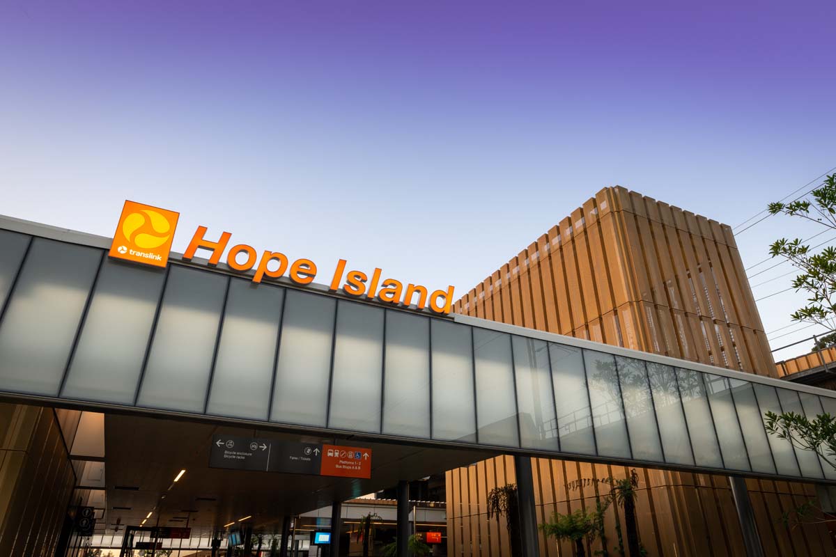 Hope Island station sign above covered concourse.