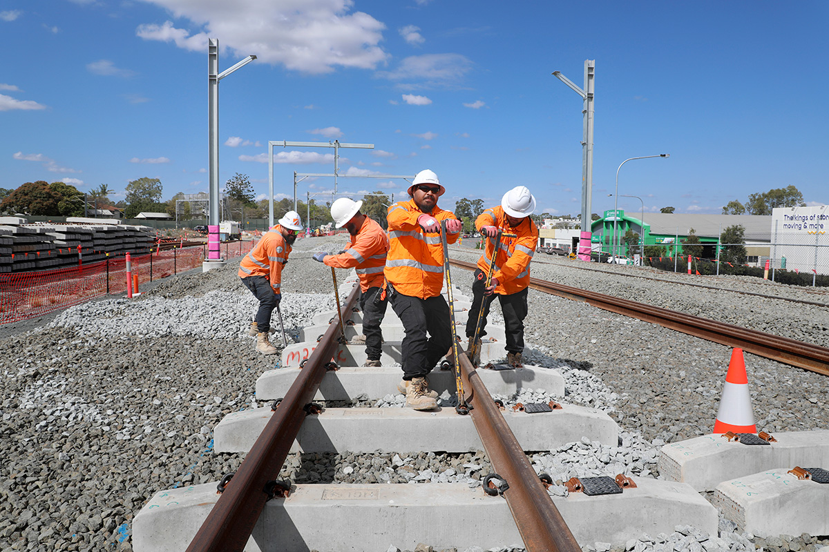 Construction workers completing works on rail lines.