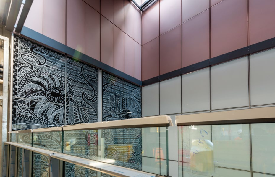 Artwork and adonised panel installation in the northern station entrance.