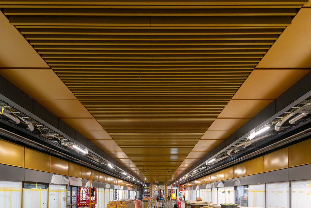 Baffled ceilings and gold panelling inside the station building