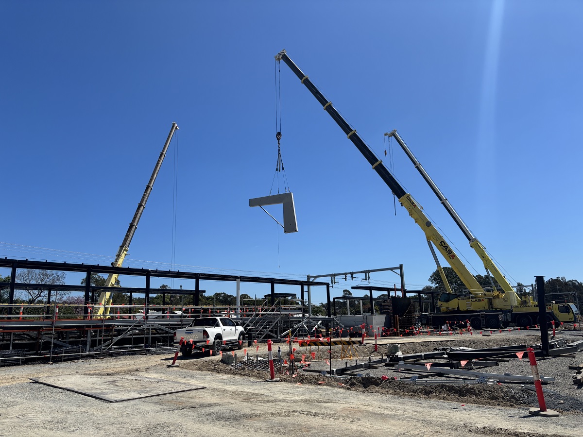 station platform construction, including pre-cast column installations.