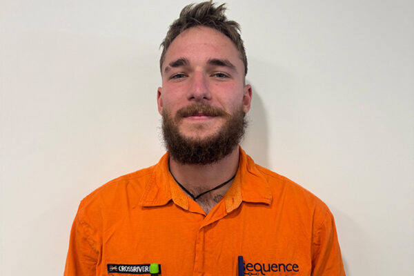 Picture of Nelson Gaston in their orange Sequence work shirt.