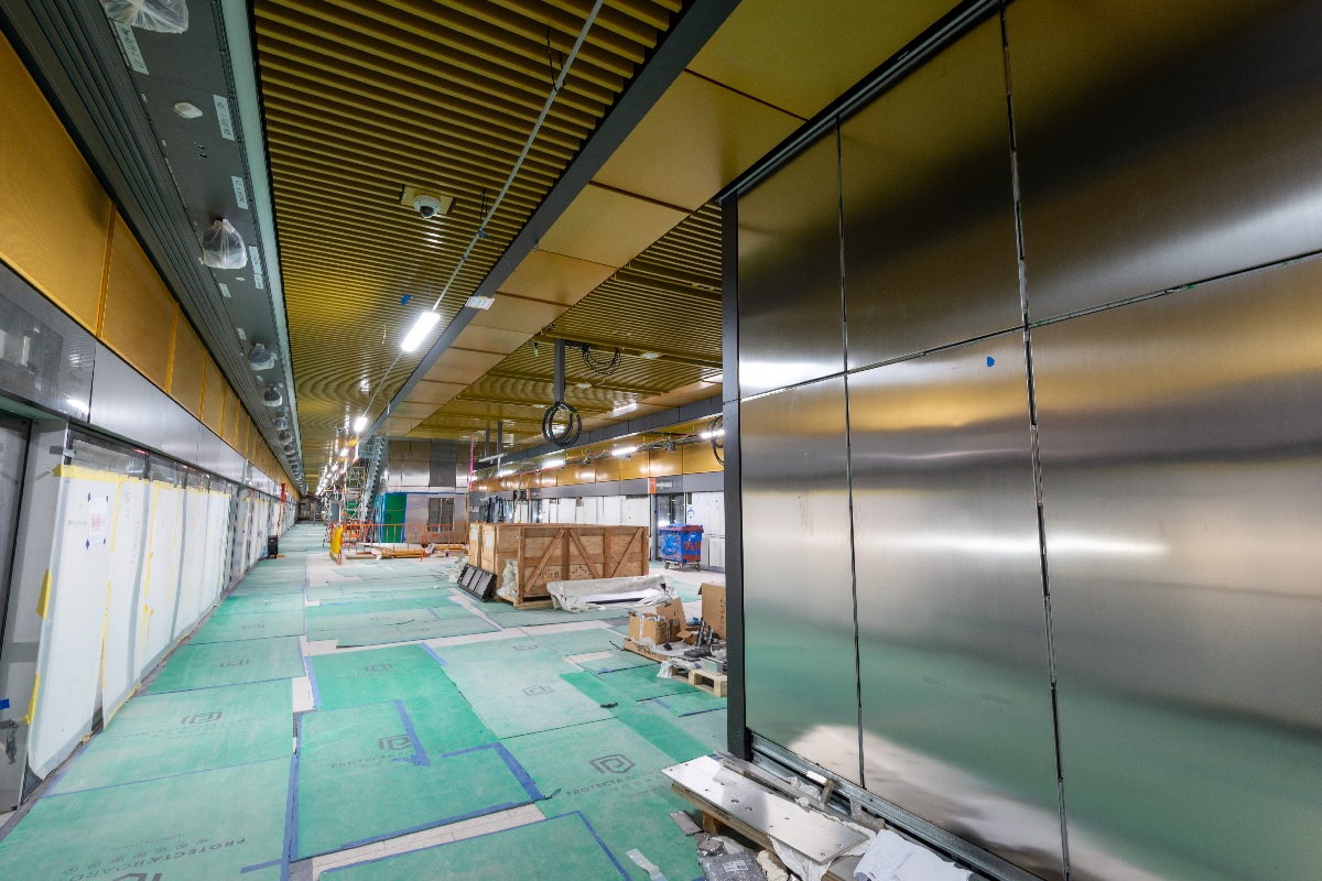 Roma Street station platform level being fit out with tiles, lighting and finishing works