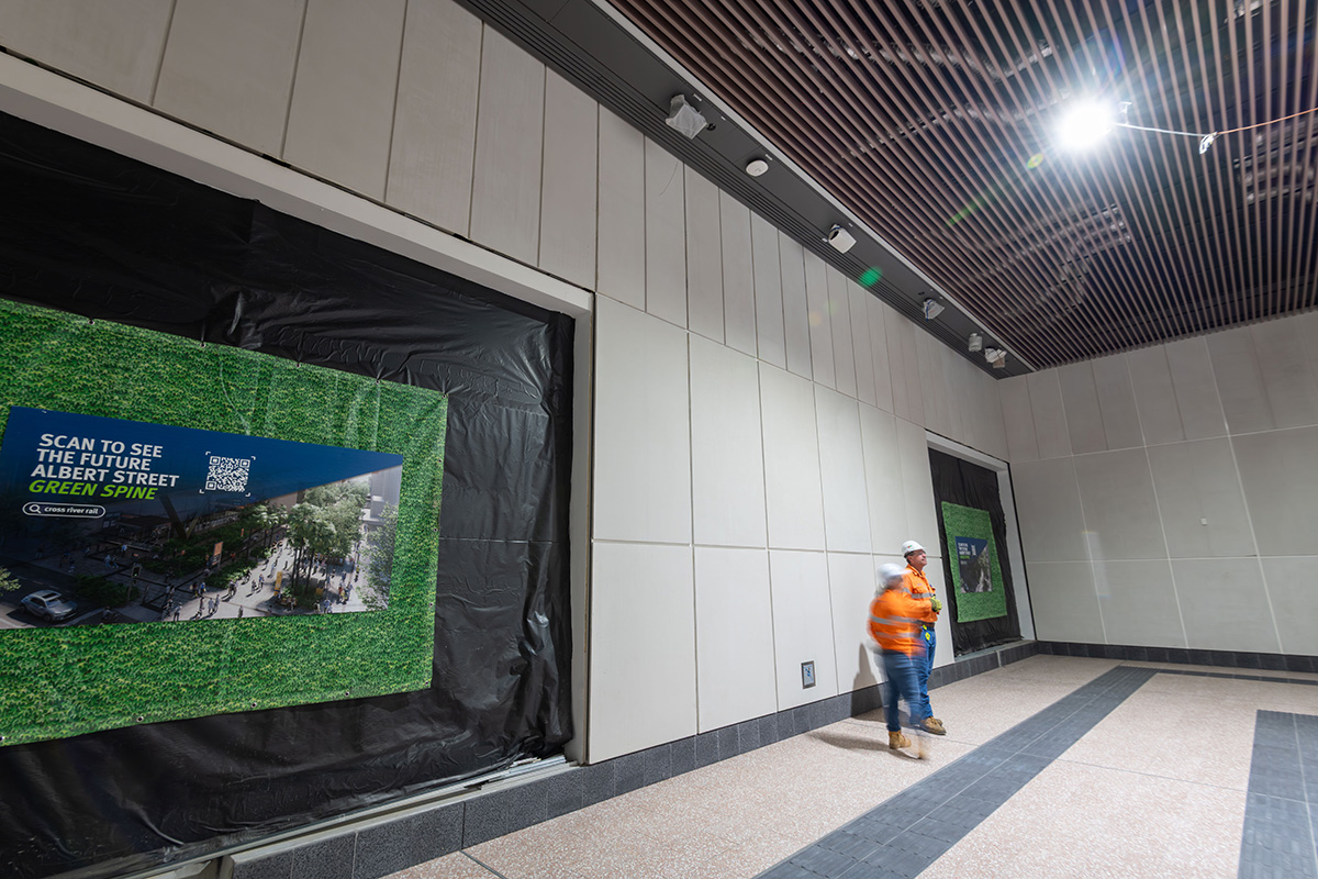 Northern station entrance (Lot 3) escalator landing to platform level.